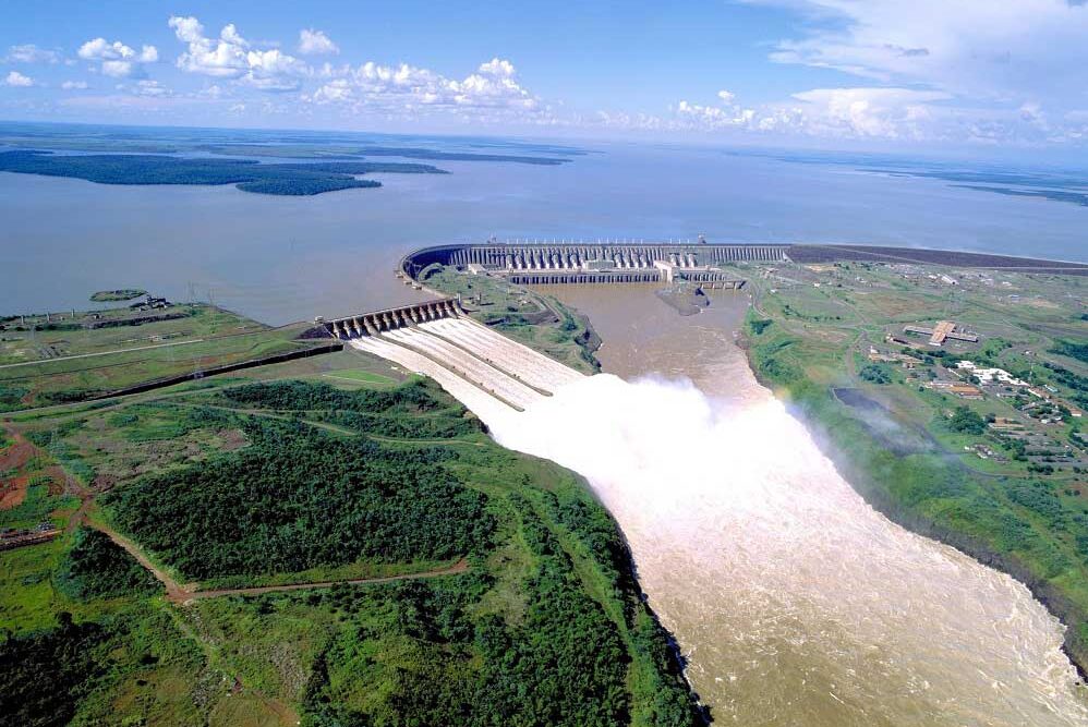 Itaipu Hydroelectric Dam Aerial view of the Itaipu Hydroelectric Dam near Foz do Iguaçu with water flowing through the spillway.